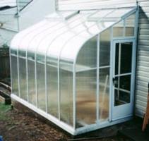 Curved Eave Lean to Greenhouse